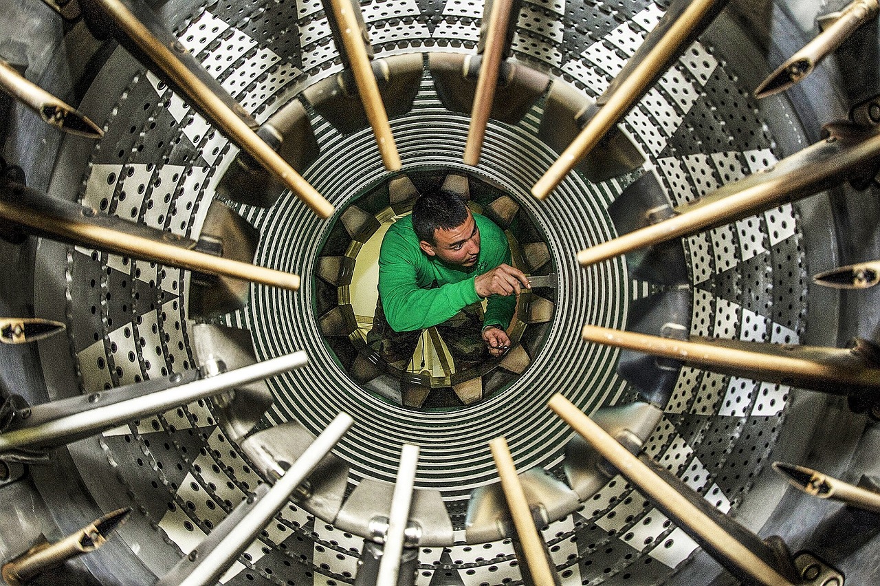 An Aviation Maintenance Engineer performing an afterburner inspection