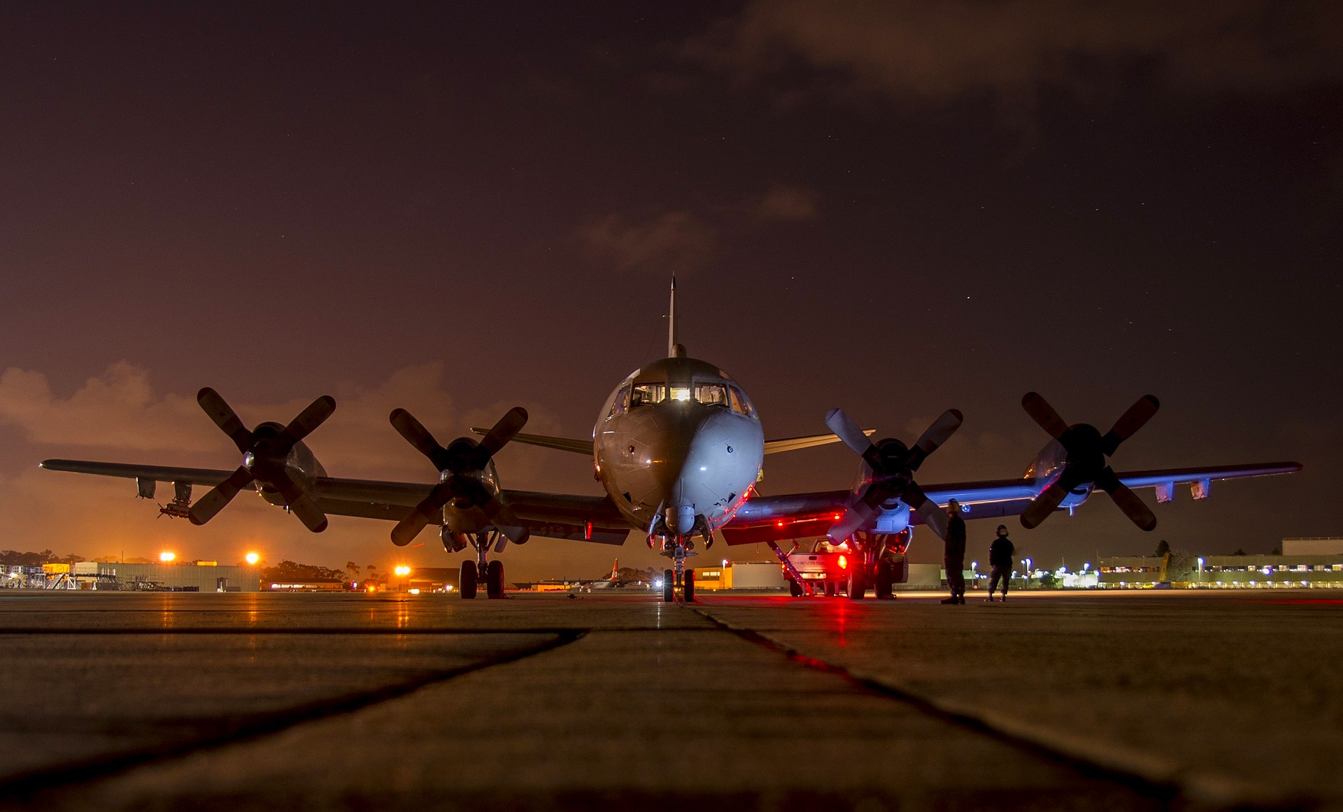 Lockheed P-3 Orion Aircraft on runway at night