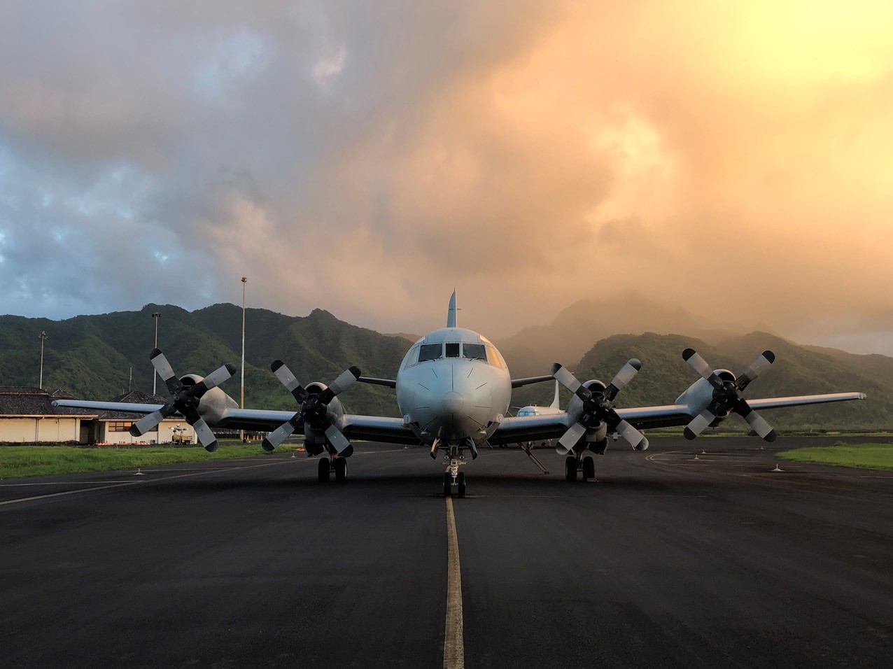 MHD-ROCKLAND Services - P-3C Aircraft on runway with mountains in background