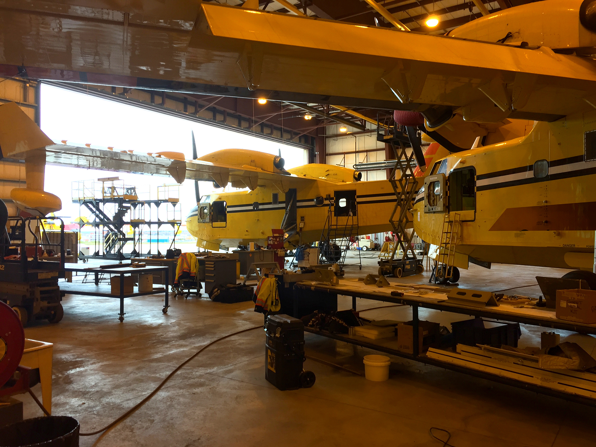 CL-415 aircraft undergoing maintenance in hangar