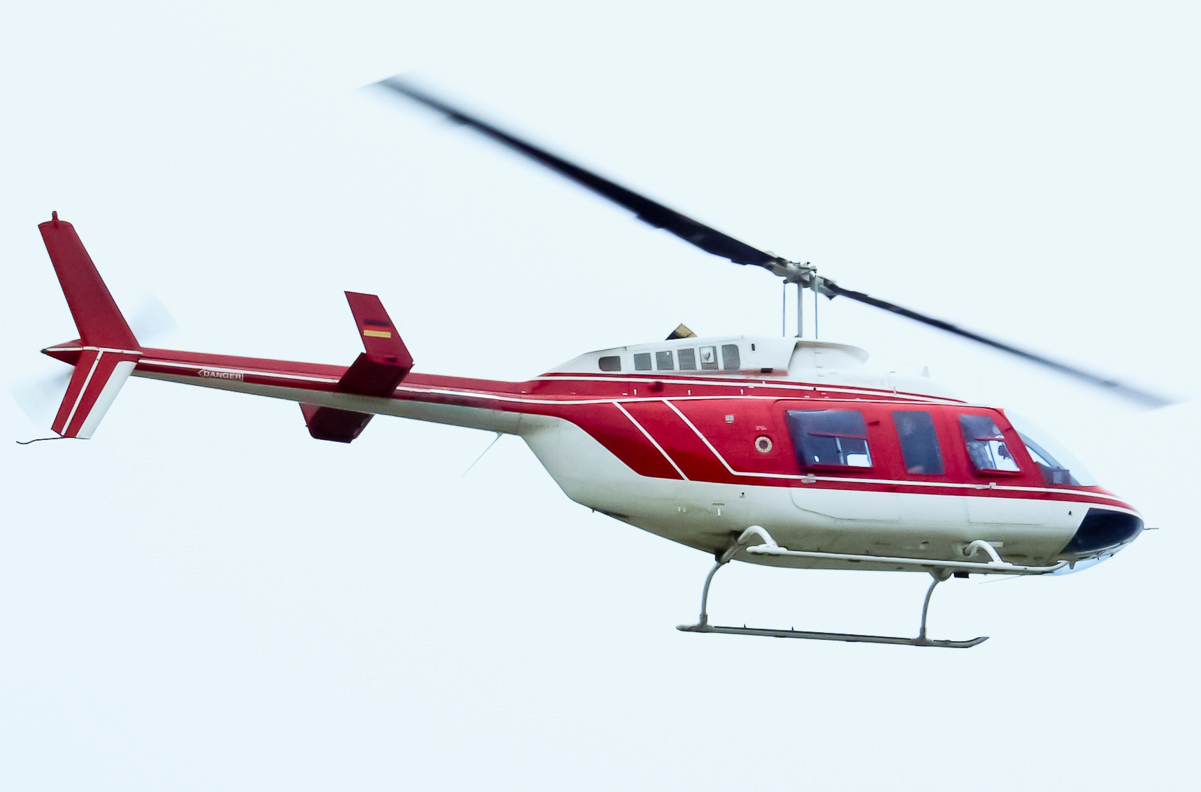 Bell 206 L-3 helicopter in mid-flight during the Niederrhein Airport Air Show in May of 2004