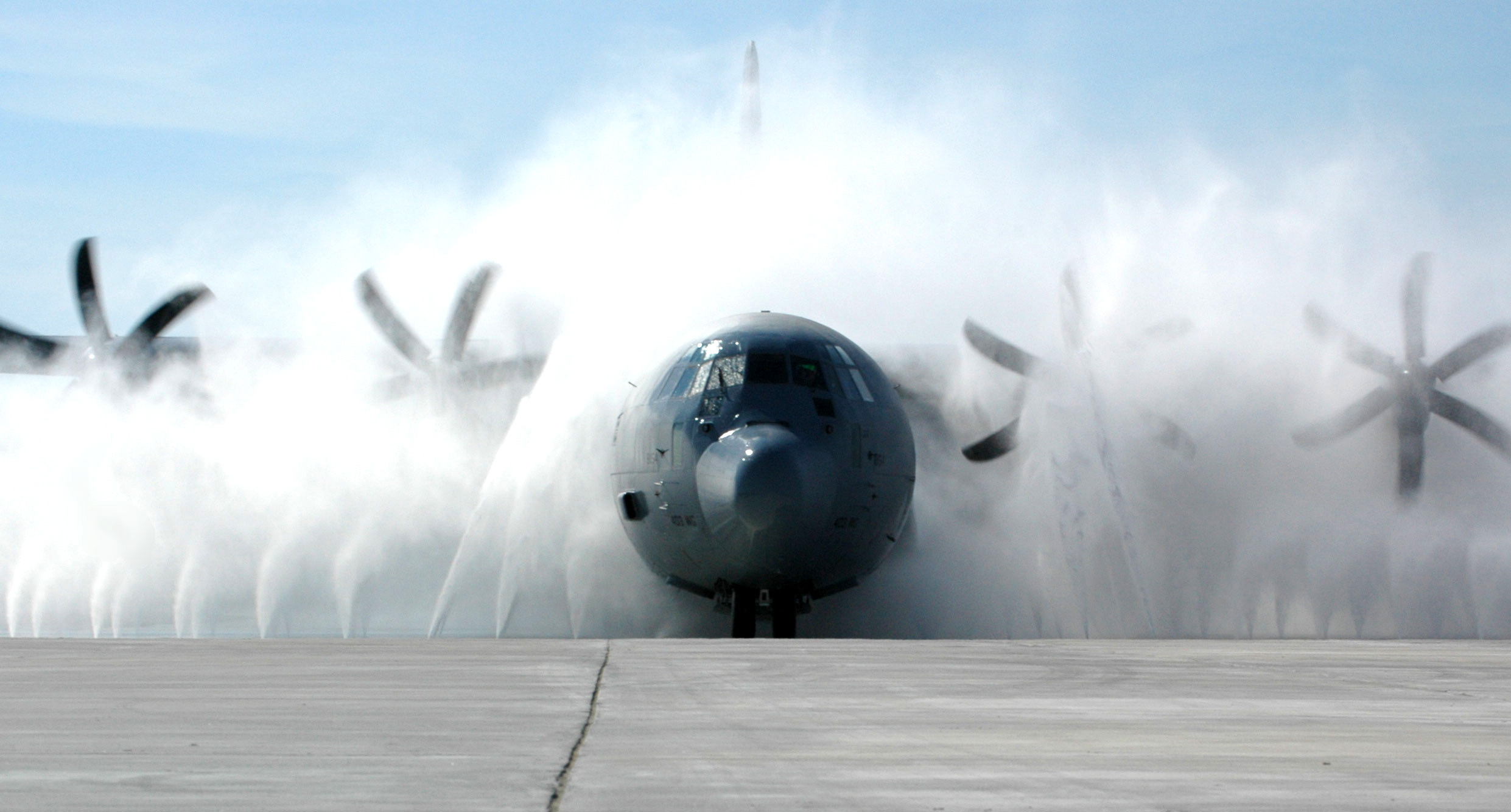 A Lockheed C-130J Hercules aircraft undergoes routine cleaning