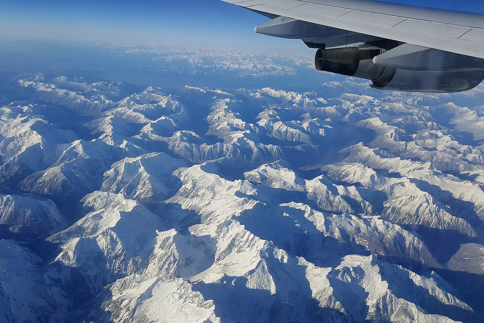 Airplane Wing and Mountains