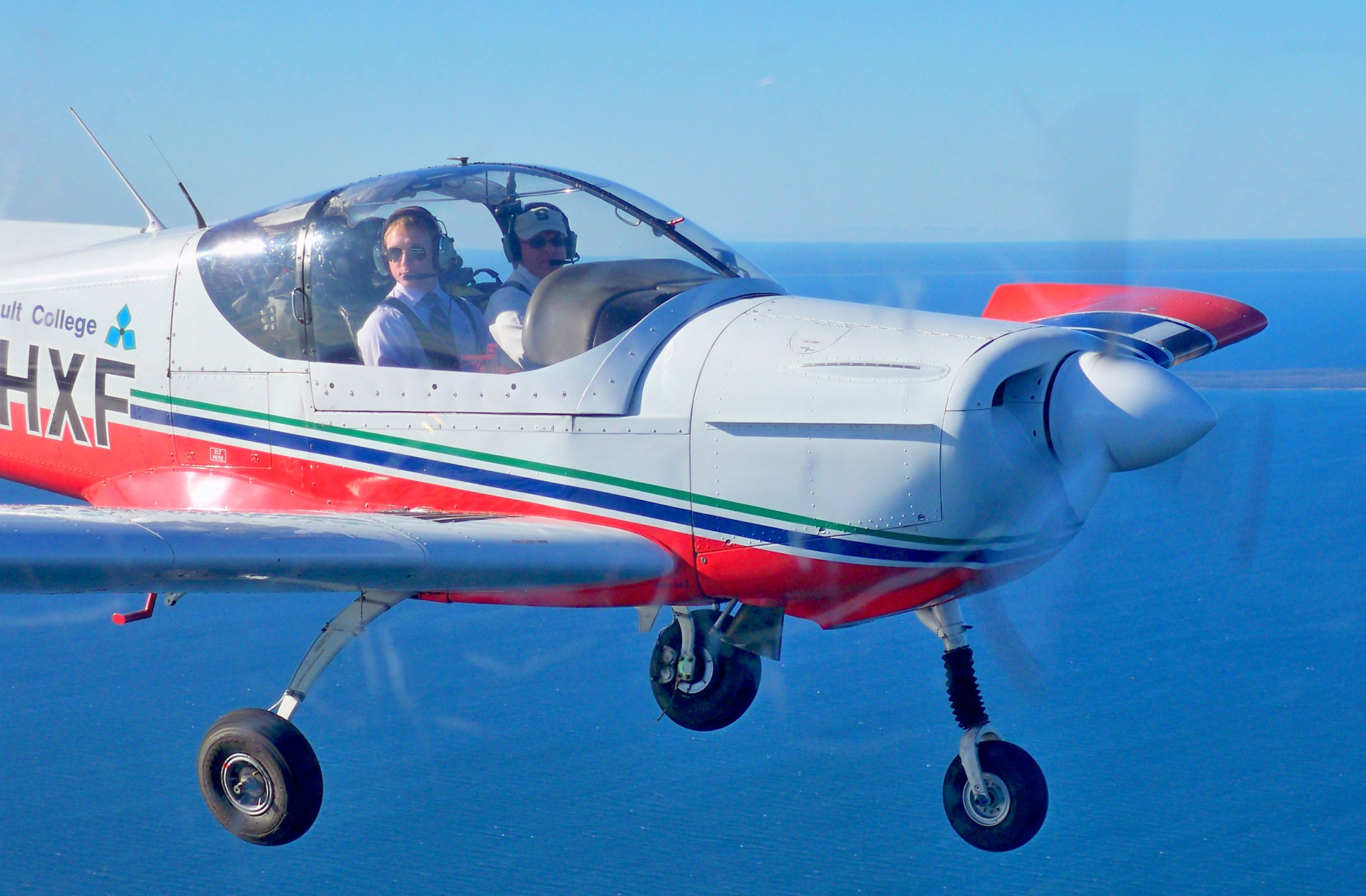 Instructor and Student Fly a Zlín Z-242L Single-engine Trainer aircraft